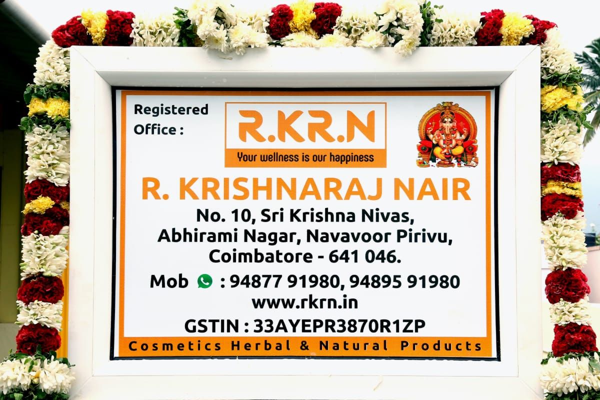 RKRN registered office signboard with ceremonial garland